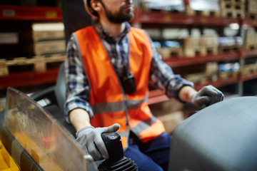 Forklifter working on loading machine © pressmaster