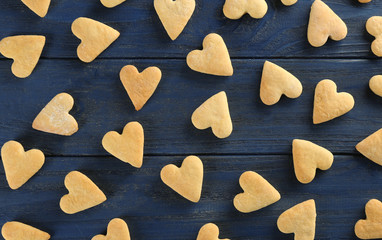 Heart shaped butter cookies on wooden background