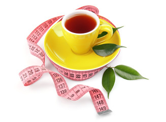 Weight loss concept. Cup of tea and measuring tape isolated on white