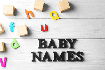 Text BABY NAMES on wooden background