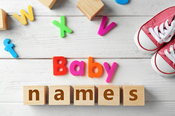 Text BABY NAMES on wooden background