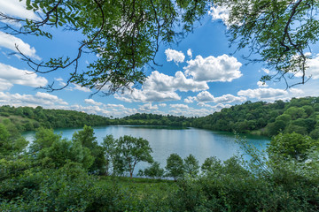 Great green water german lake in a vulcan  with amazing clouds in a sun shinning day - Maar lakes...