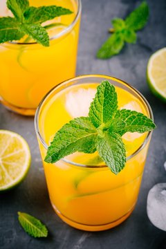 Fresh summer yellow lemonade with lime and mint