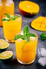 Fresh summer mango cocktail with lime and mint