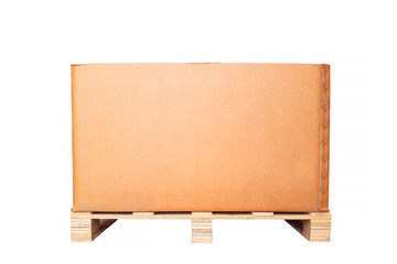 Cardboard box on a wooden pallet isolated. White background.