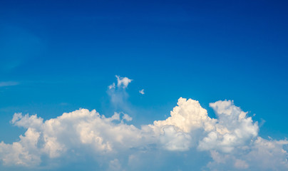 white fluffy clouds in the blue sky
