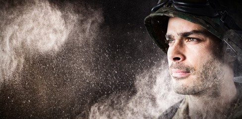 Composite image of close up of thoughtful military soldier