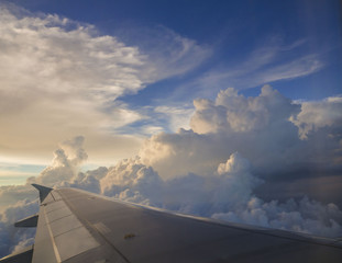 Fototapeta na wymiar Beautiful sunset sky when see through the airplane window
