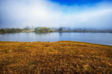 reflection. On the bank of the autumn river