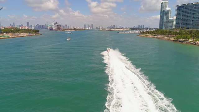 Slow motion aerial video Miami Beach speedboat Thriller touring