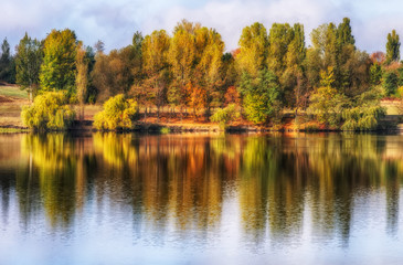 reflection. On the bank of the autumn river