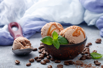 Homemade coffee ice cream with caramel and mint. Selective focus
