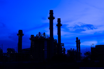Fototapeta na wymiar Silhouette of Industrial power plant at twilight.