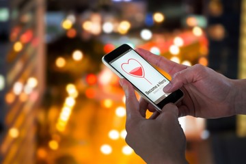 Composite image of close-up of man holding smart phone