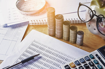  bussiness accounting report and concept save money with pen calculator on table working area