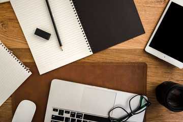 Wooden table with office supplies