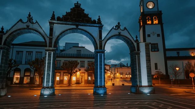 Night gimbal POV shot across the City Gates - Portas da Cidade - in Ponta Delgada, Sao Miguel, The Azores, Portugal. The Azores are one of the hidden gem destinations in Europe.