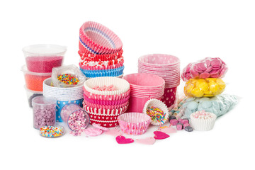 Paper cups for cupcake and colorful sprinkling for decorating