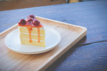 Sponge cake with cherry syrup. Peace of cherry cake served in afternoon time