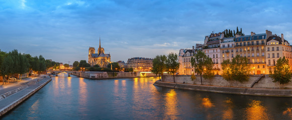 Paris city skyline panorama at Notre Dame de Paris Cathedral and Seine River when sunset, Paris, France