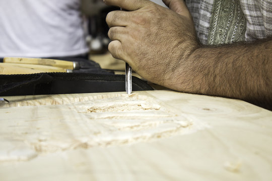 Man carving wood
