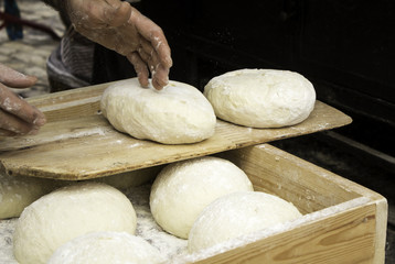 Man kneading bread