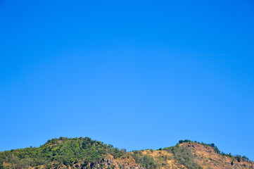 top of mountain surrounded by tropical forests of Thailand