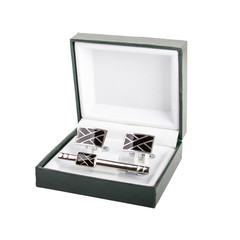 Cuff links in a box on white background