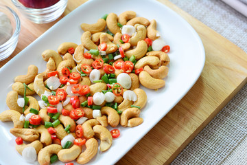 Close up cashews nut salad with chili and salt