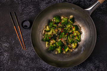 Cooking asian wok with stir fry vegetables