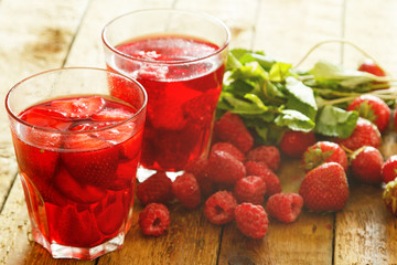 Glasses of refreshing drink with berries