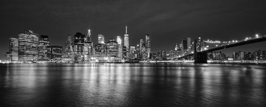 Black and white panoramic photo of Manhattan at night, New York City, USA.
