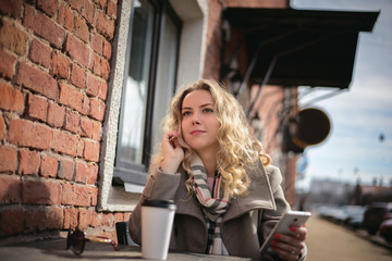 Young girl at a cafe table