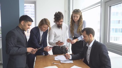 Working atmosphere in the office. Group of business people discussing business issues