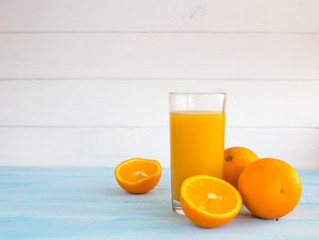 Composition of orange cut glass with juice