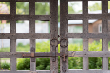 old wooden lattice on the gates in a monastery Russia