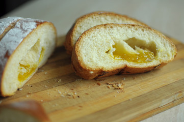 Cut pineapple pie with slices on a cutting board