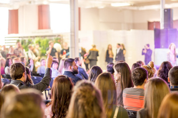 Young people at a concert as fans look at the performance of the club