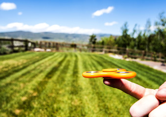 orange fidget spinner on gralls