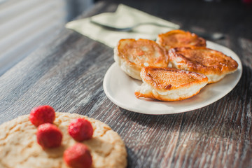 Homemade pancakes on irelke in front of the window