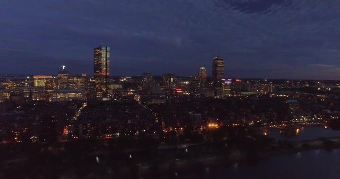 Aerial shot of twilight Boston approaching Hancock and Prudential towers