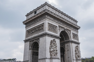 Fototapeta na wymiar Arc de Triomphe de l'Etoile on Charles de Gaulle Place, Paris, France. Arc is one of the most famous monuments in Paris.