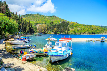 Fototapeta na wymiar Boats in port Kouloura in Corfu, Greece