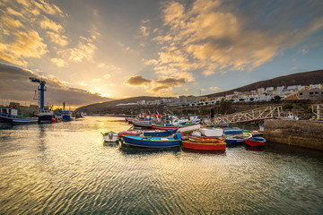 Fototapeta premium Sunset over a port in Gran Tarajal, Fuerteventura, Canary islands