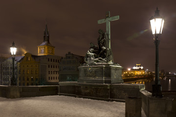 Fototapeta na wymiar Night romantic snowy Prague Old Town from Charles Bridge, Czech republic
