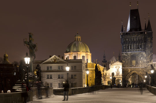 Night romantic snowy Prague Old Town from Charles Bridge, Czech republic