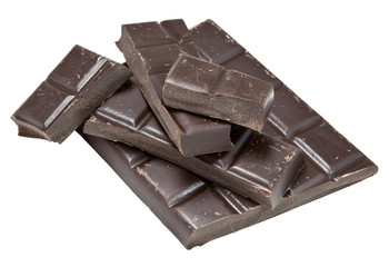 Broken and staked pieces of semi sweet dark chocolate. Isolated.