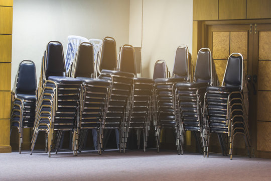 Stacked chairs in the meeting room.
