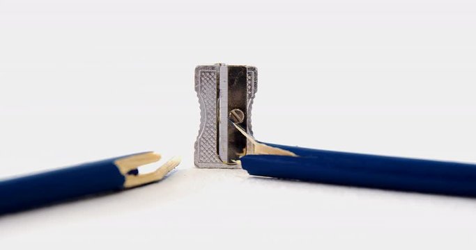 Broken blue pencil with sharpener