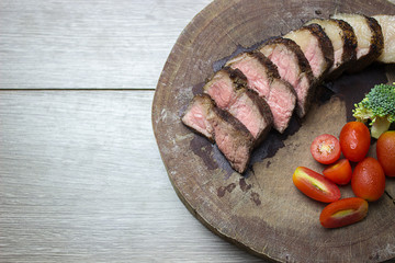 beef slides Fresh vegetables on an old wooden cutting board